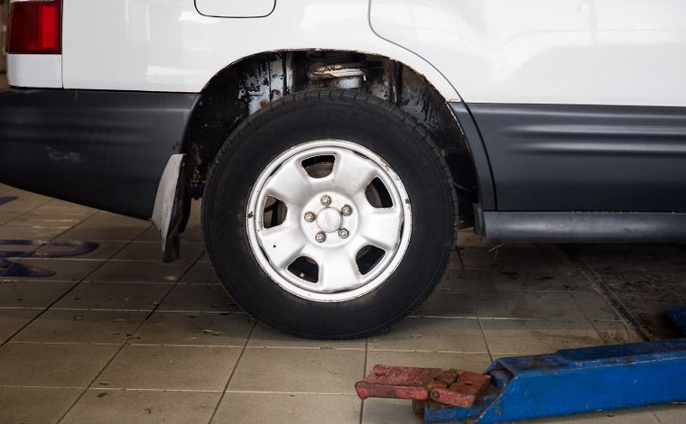 Wheel and tire on a vehicle in the shop